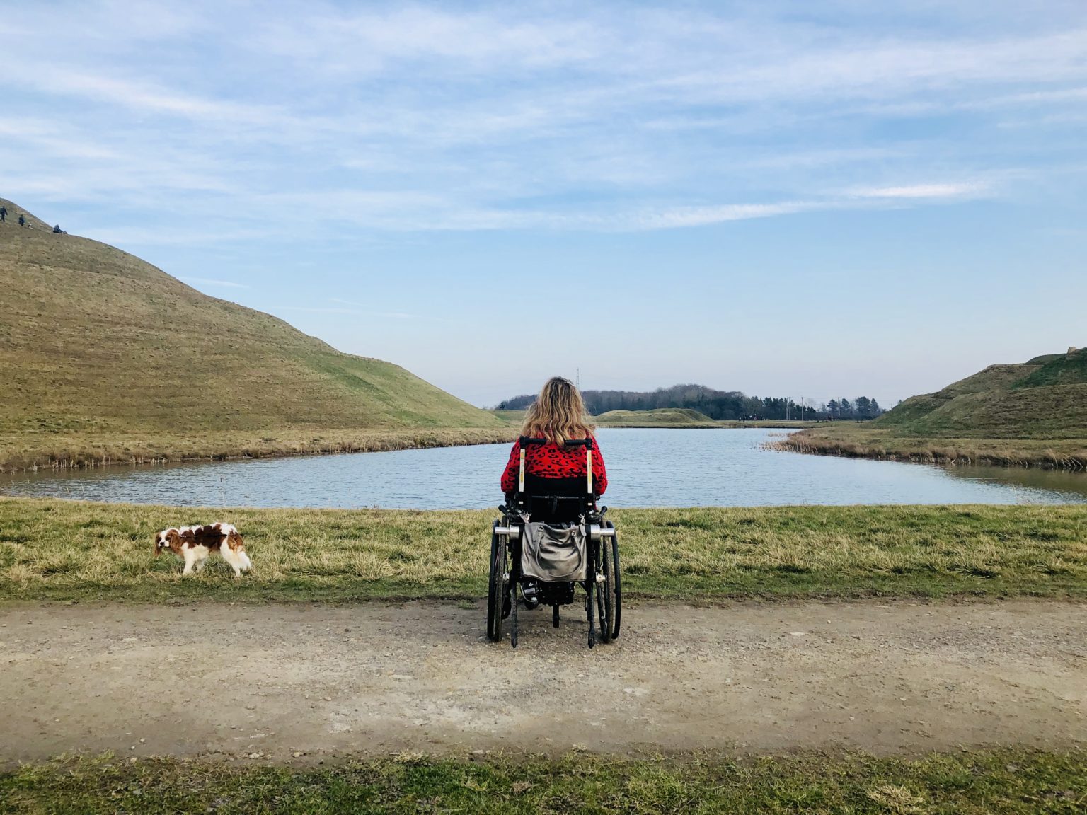 Carrie-Ann staring out to beautiful lake out of isolation