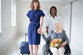 Lady in a wheelchair with carer