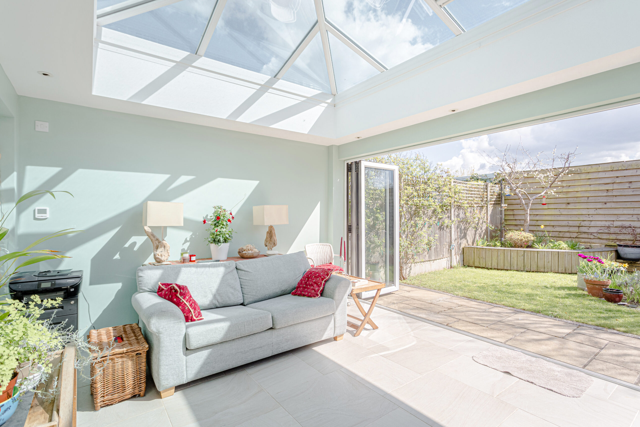 beautiful consevatory opening with bifold doors