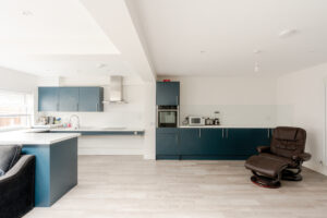 Kitchen area with rise and fall sink and hob